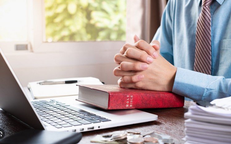 a man at work as well as balancing his faith