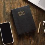 holy bible and a mobile phone