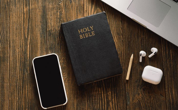 holy bible and a mobile phone